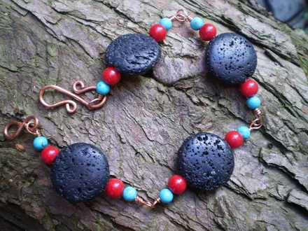 A bracelet of carved black volcanic lava beads — the kind of thing sold here