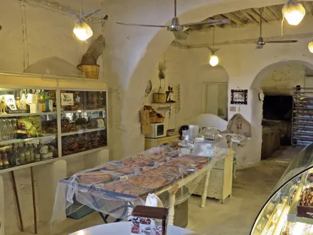The vaulted underground room at Gioras, with the wood-fired oven