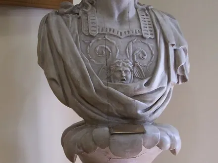 A 19th-century Greek ship’s figurehead — the kind of thing Oia’s collection is built around, though this one is in Athens